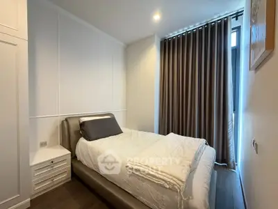 Cozy modern bedroom with elegant curtains and sleek furniture design