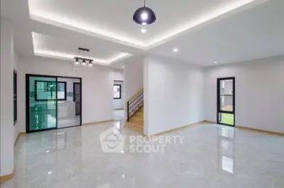 Spacious modern living room with elegant lighting and open layout