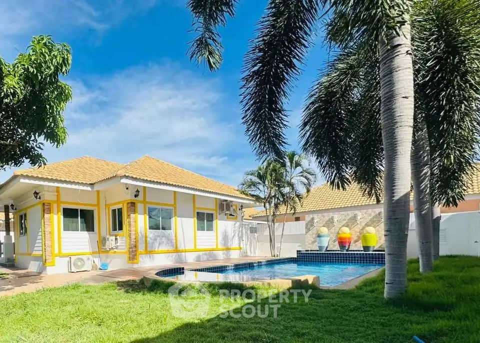 Charming villa with private pool and lush garden in tropical setting.