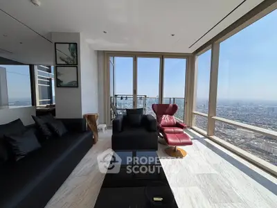 Luxurious living room with panoramic city view and modern furniture in high-rise apartment.
