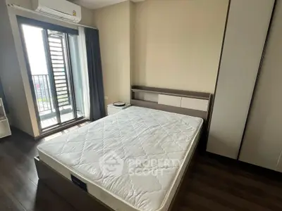 Modern bedroom with balcony access and sleek design