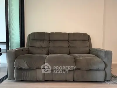 Cozy living room with plush gray sofa and modern decor
