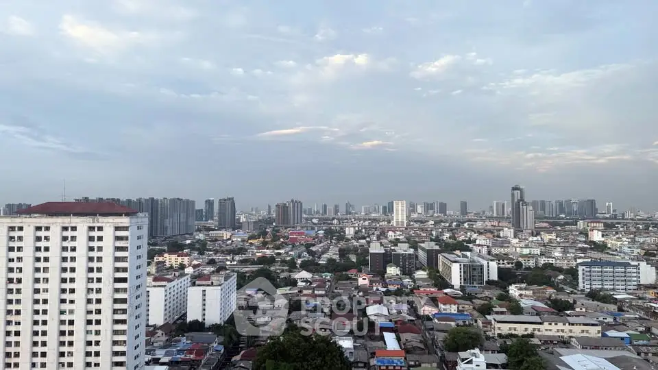 Stunning cityscape view showcasing urban skyline and residential buildings at dawn.