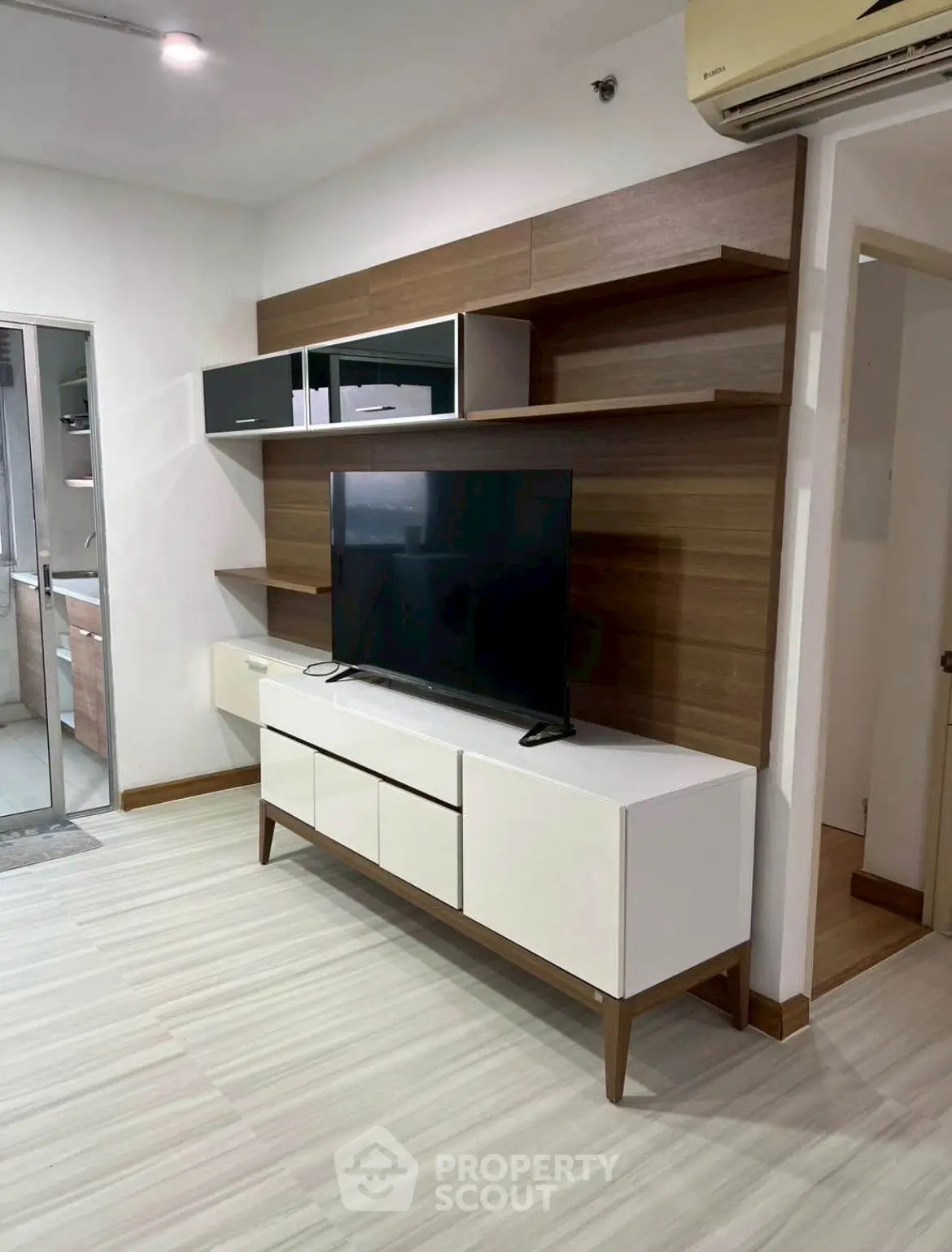 Modern living room with sleek TV unit and stylish shelving