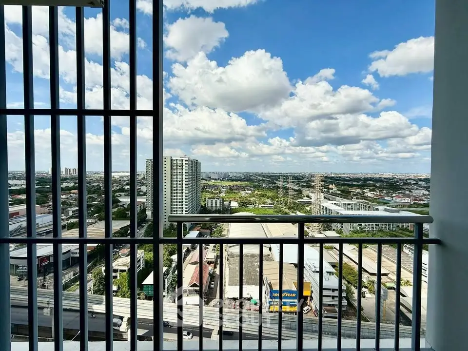Stunning cityscape view from high-rise balcony with expansive skyline.