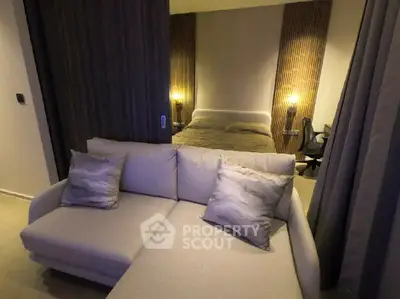 Modern studio apartment with cozy living area and stylish bedroom