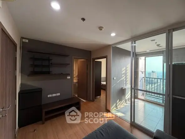 Modern apartment living room with balcony and city view