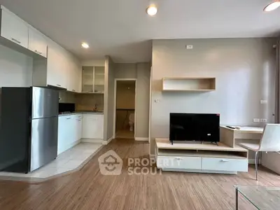 Modern open-plan living room with sleek kitchen and stylish furnishings