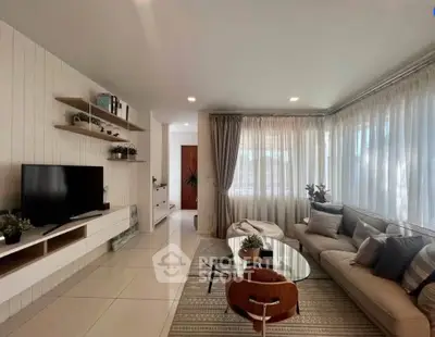 Spacious modern living room with elegant decor and natural light