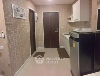 Cozy kitchen with brick accent wall and modern appliances