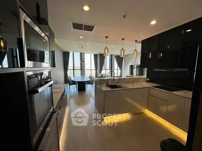 Luxurious modern kitchen with open layout and stunning city view, featuring sleek cabinetry and elegant lighting.