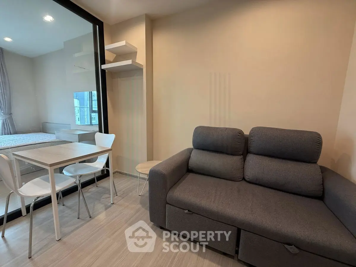 Modern living room with cozy sofa and dining area in a stylish apartment