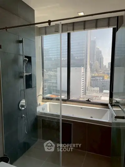 Luxurious bathroom with city view and modern bathtub in high-rise apartment.