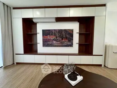 Stylish living room with modern built-in shelves and unique artwork