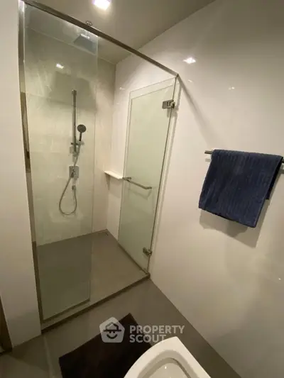 Modern bathroom with glass shower enclosure and sleek design