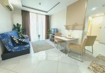 Modern living room with stylish decor and natural light, featuring a cozy dining area and elegant furnishings.