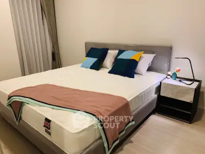 Modern bedroom with stylish decor and comfortable bed in a cozy apartment.