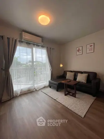 Cozy living room with balcony view, modern sofa, and ambient lighting