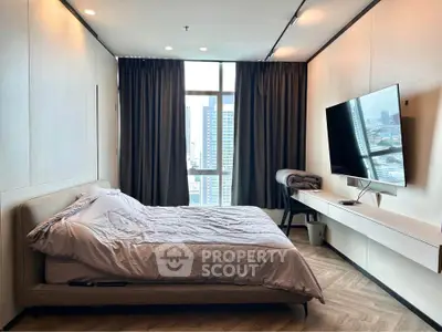 Modern bedroom with city view, featuring sleek design and large windows for natural light.