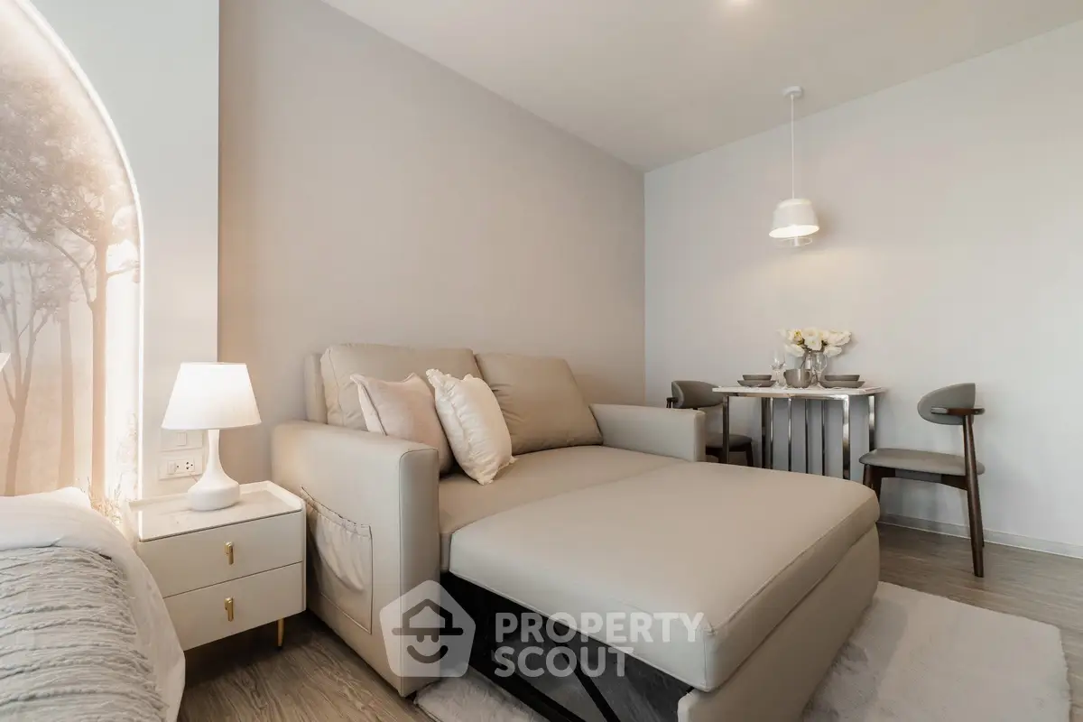 Modern living room with stylish furniture and elegant dining area, perfect for urban living.