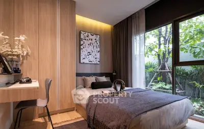 Modern bedroom with large window and garden view, featuring stylish decor and cozy ambiance.