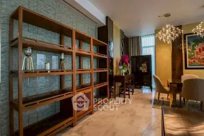 Luxurious living room with elegant decor and modern lighting fixtures.