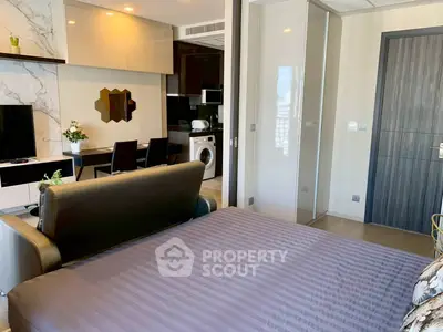 Modern studio apartment with stylish decor and in-unit washing machine