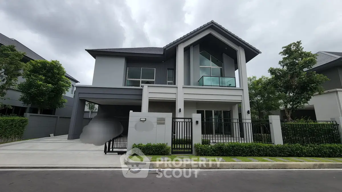 Modern two-story house with sleek design and spacious driveway in a serene neighborhood.