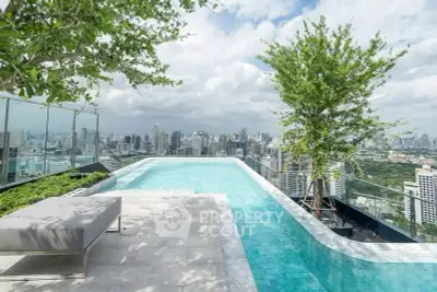 Luxurious rooftop pool with stunning city skyline view, perfect for relaxation and entertainment.