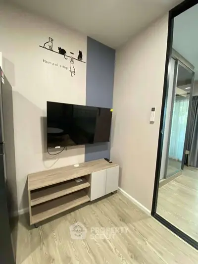 Modern living room with wall-mounted TV and stylish decor