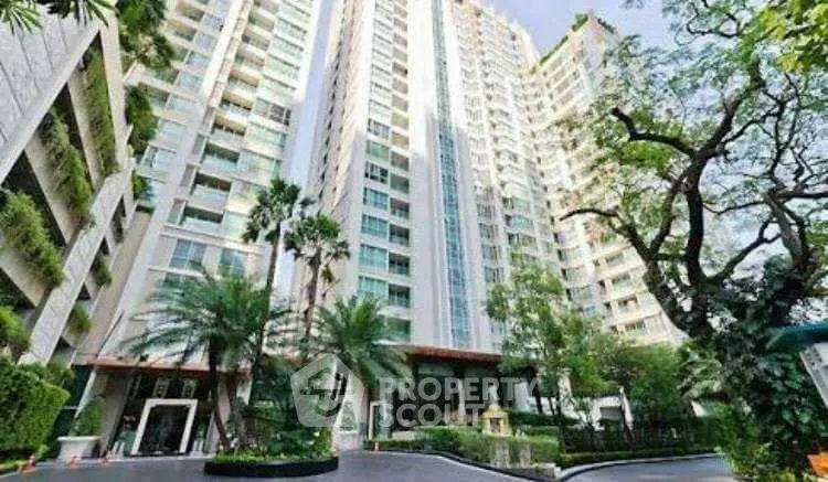 Stunning high-rise building with lush greenery and modern architecture.