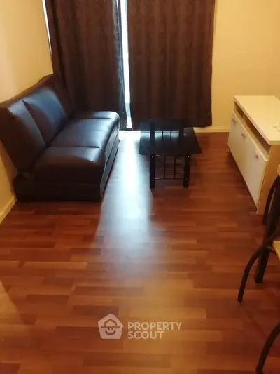 Cozy living room with wooden flooring and modern furniture