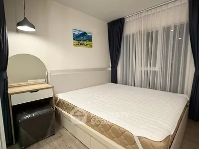 Modern bedroom with stylish decor and large window for natural light