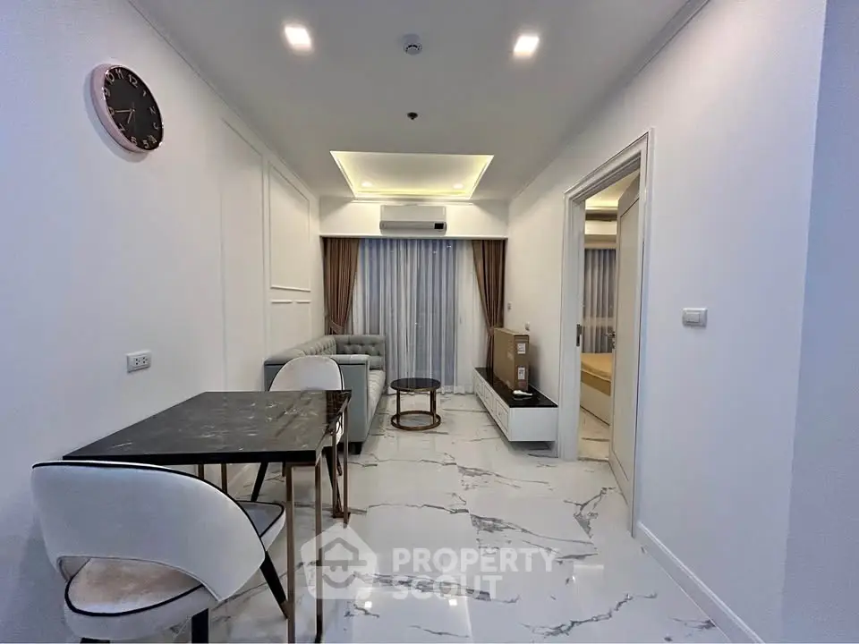 Modern living room with marble flooring and stylish furniture in a contemporary apartment.