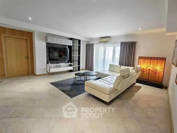 Spacious modern living room with elegant furniture and natural light