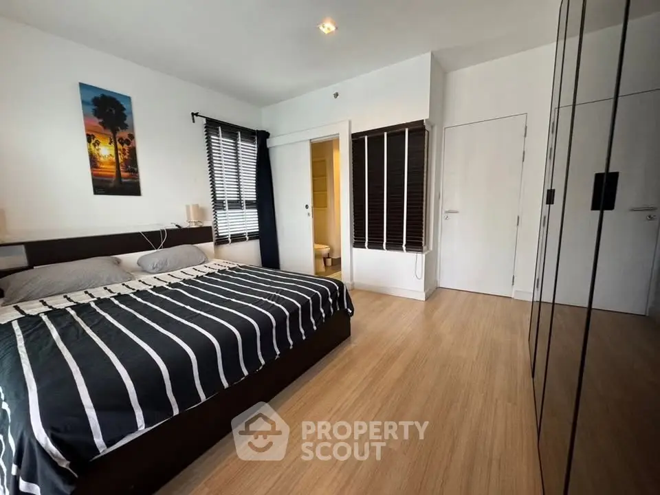 Modern bedroom with stylish decor and ample natural light