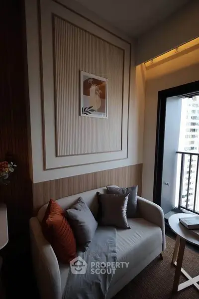 Cozy living room with modern decor and balcony view in urban apartment