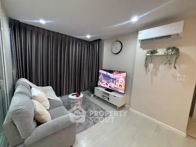 Cozy modern living room with stylish decor and air conditioning