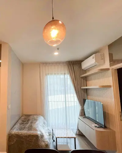 Modern living room with stylish lighting and air conditioning