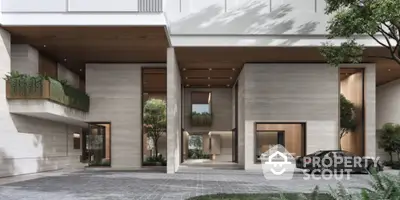 Luxurious modern building entrance with sleek design and elegant landscaping