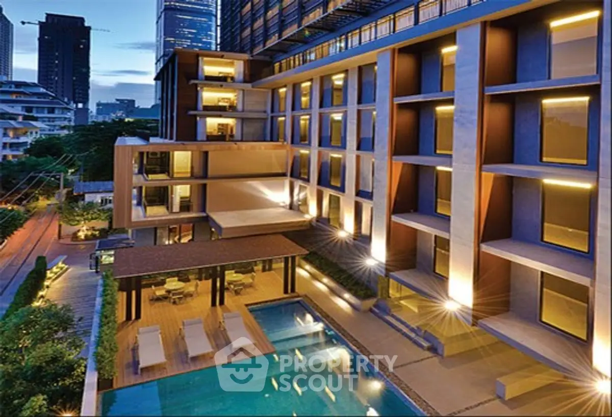 Luxurious modern apartment building with pool and stunning city view