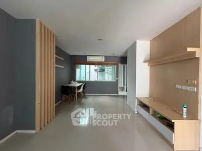 Spacious modern living room with sleek design and ample natural light