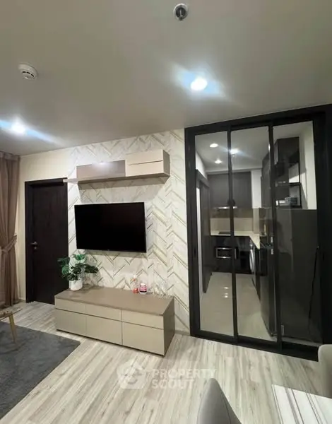Modern living room with sleek kitchen and stylish decor