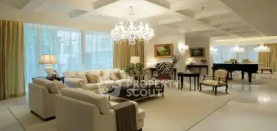 Luxurious living room with elegant chandeliers and grand piano, perfect for sophisticated entertaining.