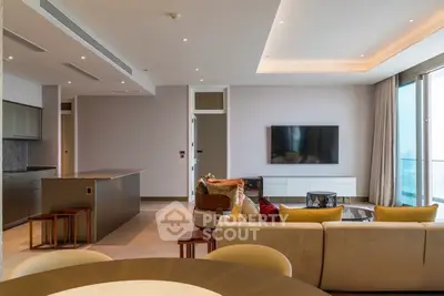 Luxurious modern living room with open kitchen and stunning city view