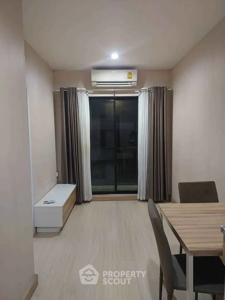 Modern minimalist room with large window and air conditioning, perfect for cozy living.