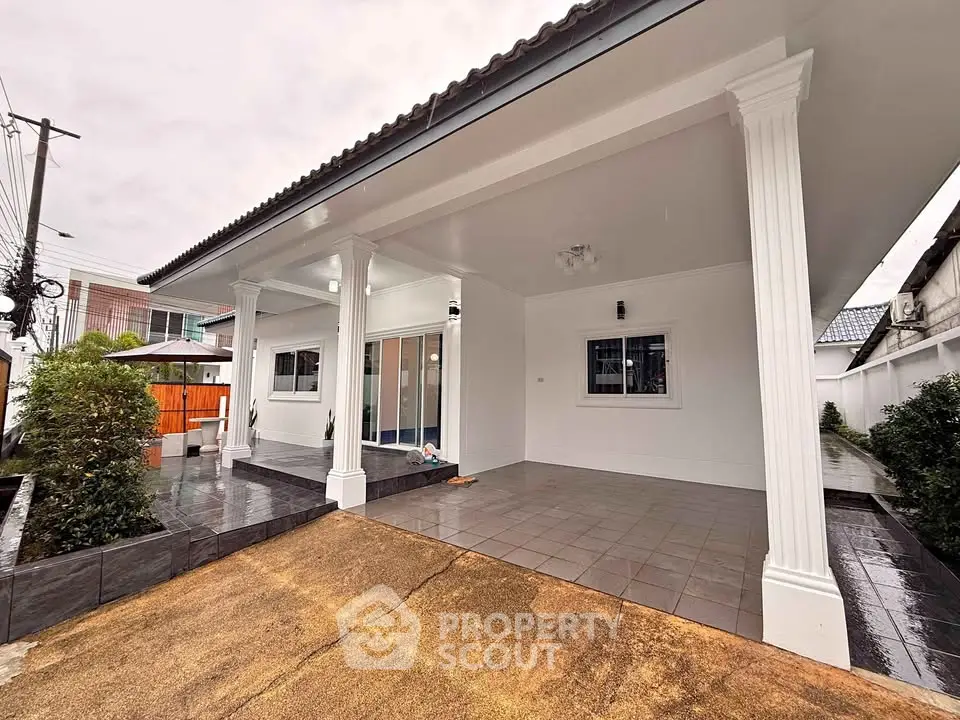 Charming single-story home with covered patio and modern exterior design.