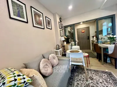 Cozy living room with stylish decor and compact dining area