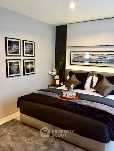 Luxurious bedroom with elegant decor and plush bedding in modern apartment