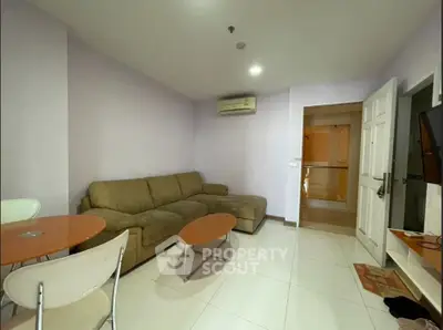 Cozy living room with modern furniture and air conditioning in a stylish apartment.